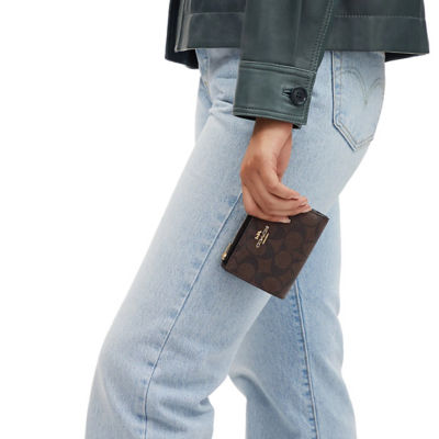 Coach bifold wallet in signature canvas sale